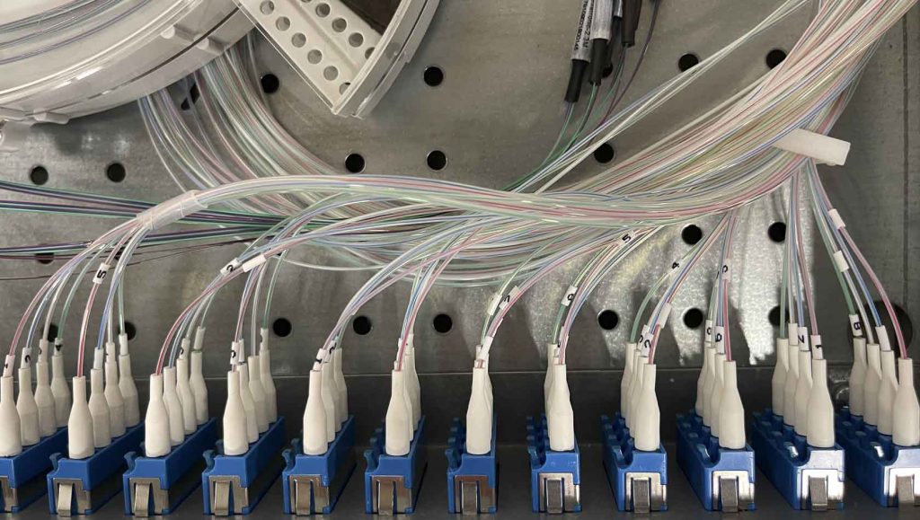 A bundle of wires all plugged in to different ports
