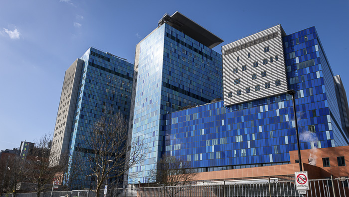 Exterior shot of a blue glass clad building